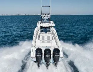 Slide: The Image of 2022 Invincible 36 Open Fisherman boat speeding on open water. - 4