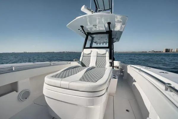 Slide: The Image of 2022 Invincible 36 Open Fisherman boat with sleek seating on open water. - 5