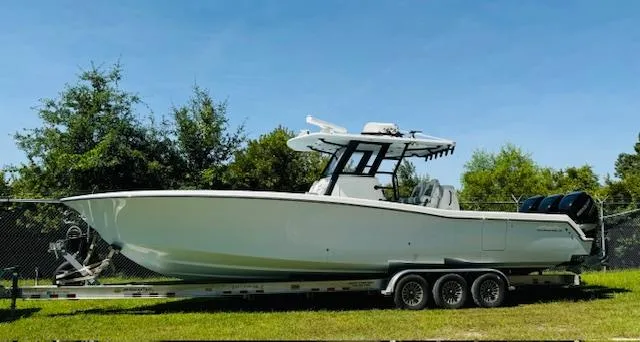 Slide: The Image of 2022 Invincible 36 Open Fisherman boat on trailer, parked outdoors. - 8