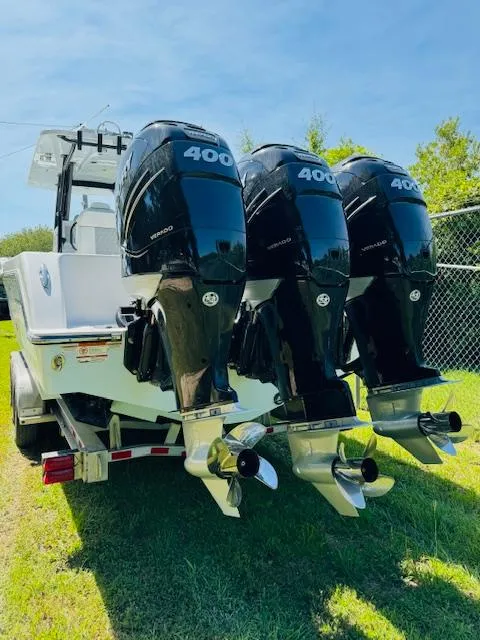 Slide: The Image of 2022 Invincible 36 Open Fisherman with triple 400 horsepower engines on a trailer. - 9