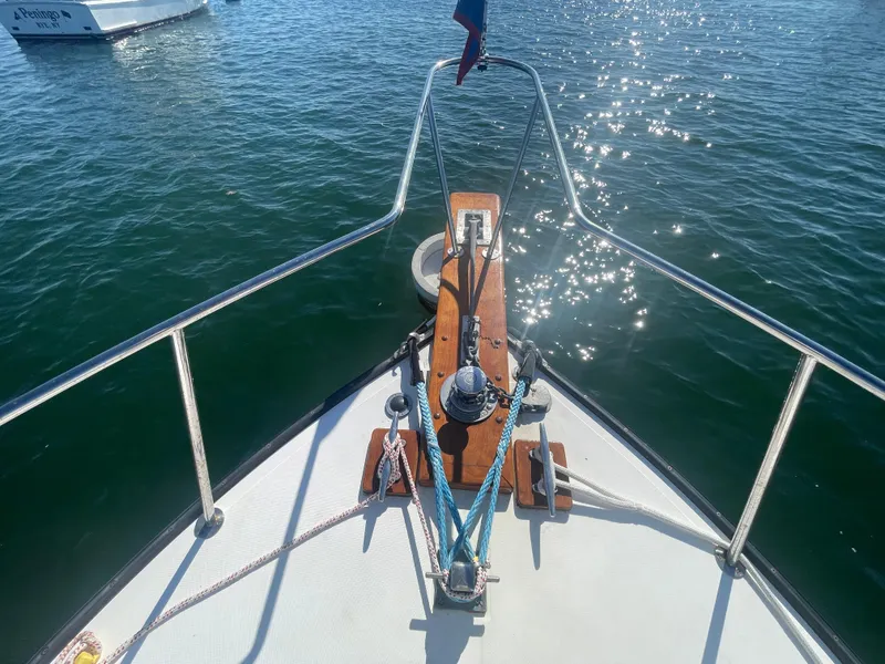 Slide: The Image of Bow of 1988 Ellis 28 boat on sparkling water. - 10