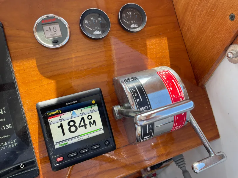 Slide: The Image of Control panel of a 1988 Ellis 28 boat with gauges and throttle lever. - 20