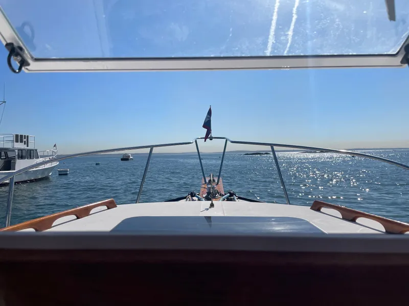 Slide: The Image of View from 1988 Ellis 28 boat, overlooking calm sea and clear blue sky. - 22