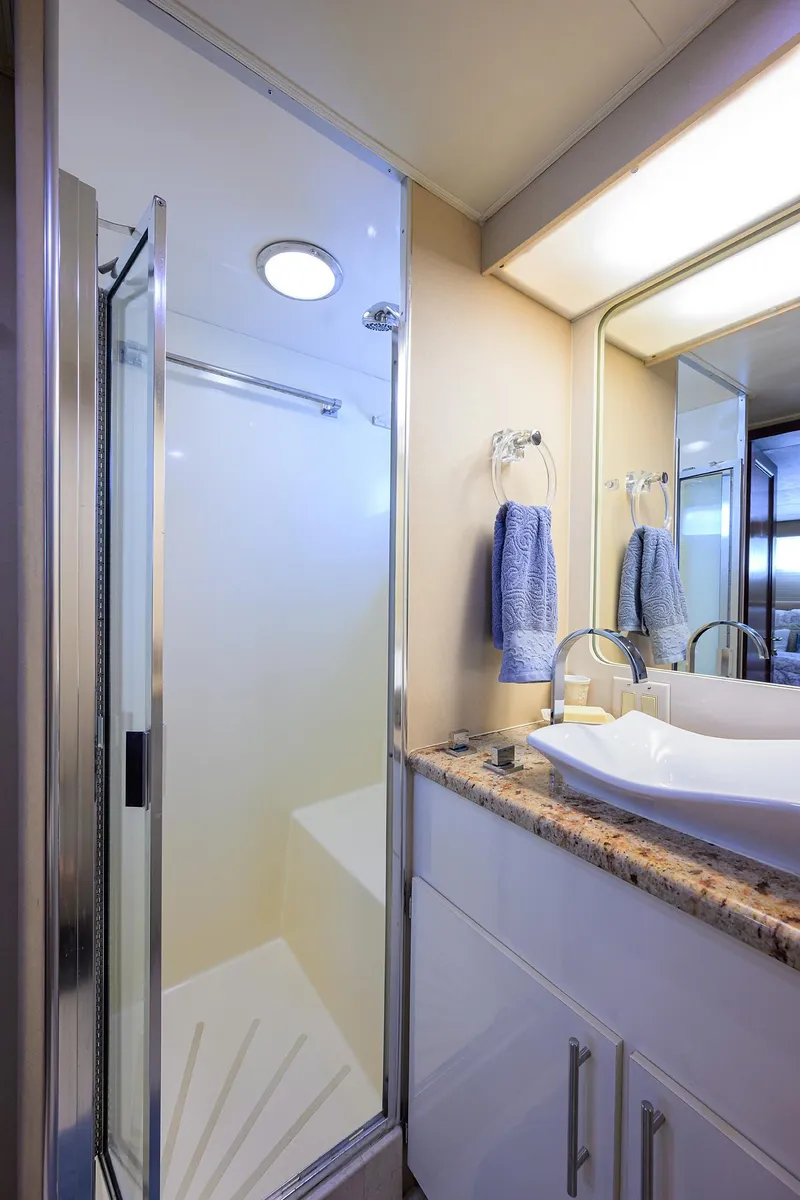 Slide: The Image of Luxurious bathroom on 1991 Hatteras 78 CMY yacht with modern fixtures and elegant design. - 39