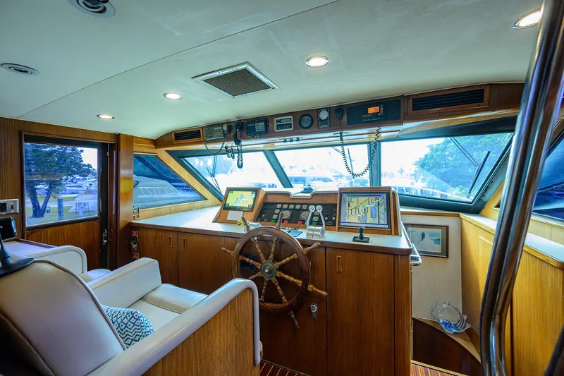 Slide: The Image of Interior of 1991 Hatteras 78 CMY yacht with wooden helm and navigation equipment. - 48