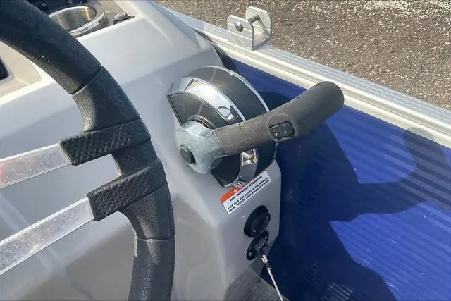 Slide: The Image of Steering wheel and throttle of 2021 Bennington 22 SL boat. - 16