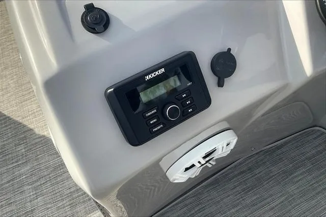 Slide: The Image of Control panel of a 2021 Bennington 22 SL boat featuring a Kicker audio system. - 19