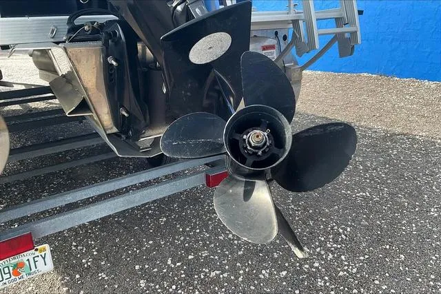 Slide: The Image of Propeller of a 2021 Bennington 22 SL boat on a trailer. - 30