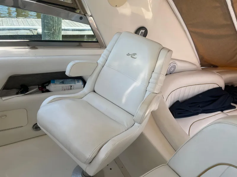 Slide: The Image of White leather seat on 1996 Sea Ray 450 Sundancer boat interior. - 14