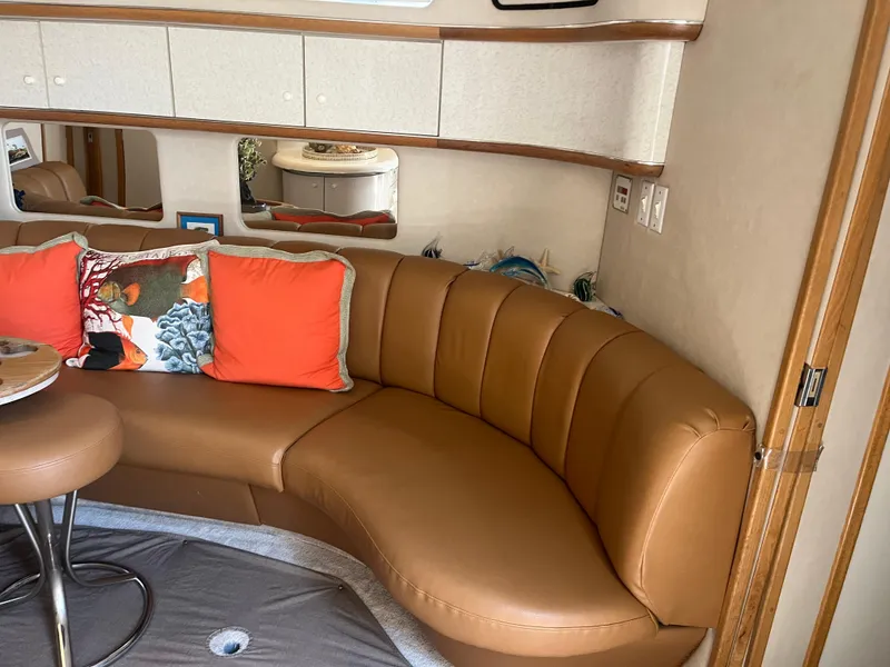 Slide: The Image of Interior of 1996 Sea Ray 450 Sundancer with leather seating and decorative pillows. - 16