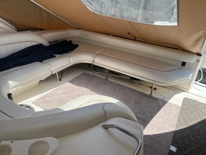 Slide: The Image of Interior of 1996 Sea Ray 450 Sundancer with beige seating and carpet. - 6