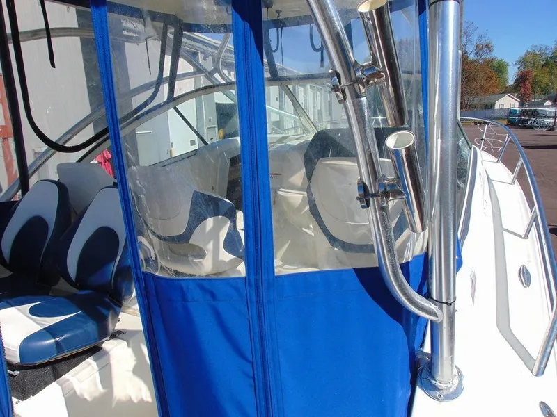 Slide: The Image of 2011 Hydra-Sports 3000VX Express boat with blue canopy and seating area. - 10