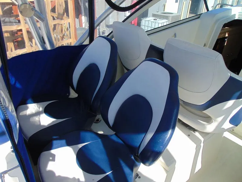 Slide: The Image of 2011 Hydra-Sports 3000VX Express boat interior with blue and white seating. - 12