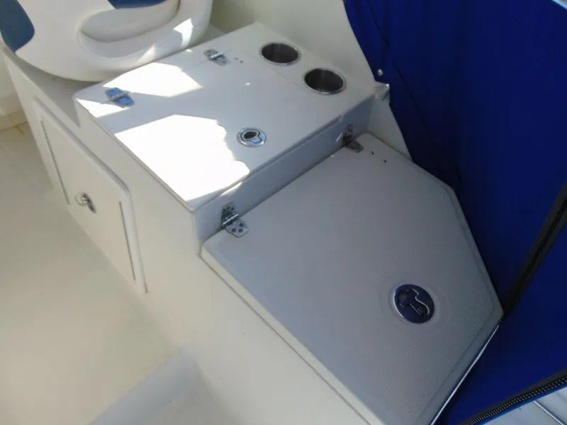 Slide: The Image of 2011 Hydra-Sports 3000VX Express interior with storage compartments and cup holders. - 13