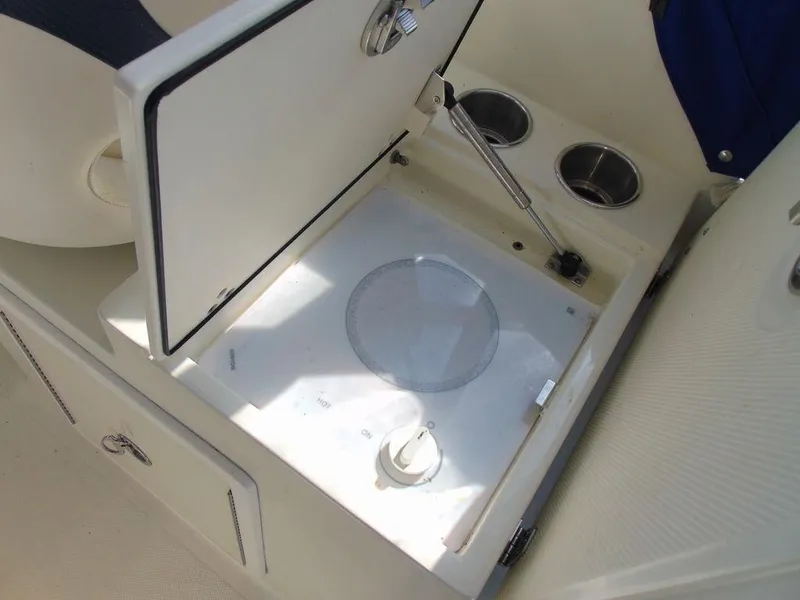 Slide: The Image of Open storage compartment on 2011 Hydra-Sports 3000VX Express boat. - 14