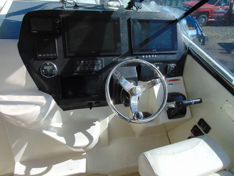 Slide: The Image of Helm of 2011 Hydra-Sports 3000VX Express with steering wheel and navigation displays. - 17