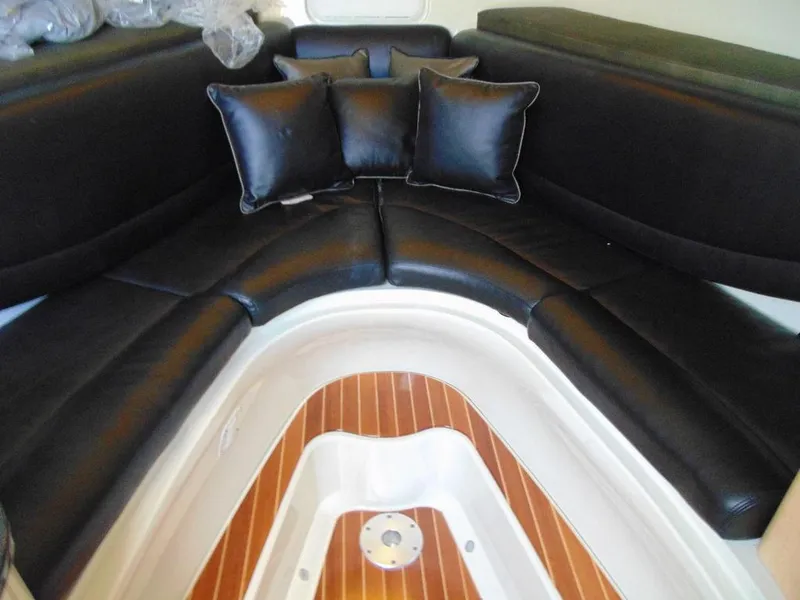 Slide: The Image of 2011 Hydra-Sports 3000VX Express cabin with black leather seating and wood flooring. - 22