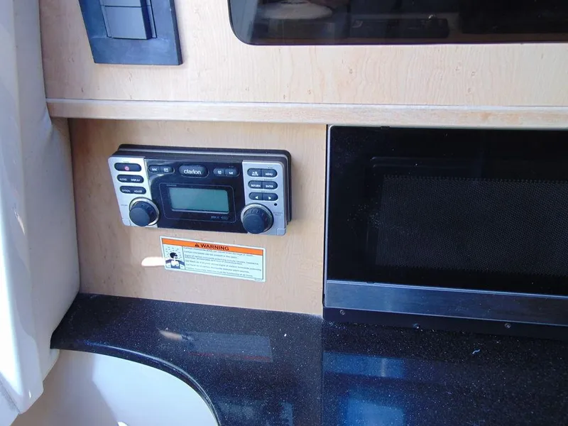 Slide: The Image of 2011 Hydra-Sports 3000VX Express cabin interior with radio and control panel. - 25