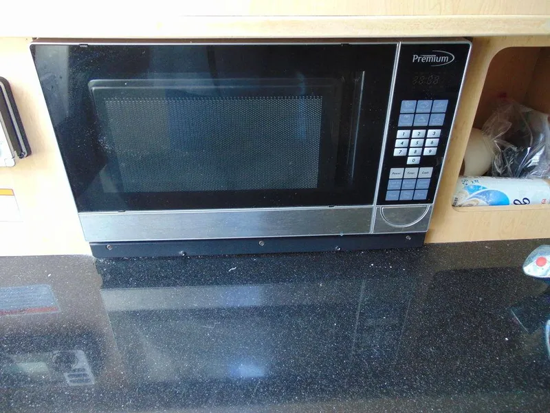 Slide: The Image of Built-in microwave on Hydra-Sports 3000VX Express 2011 boat kitchen counter. - 27