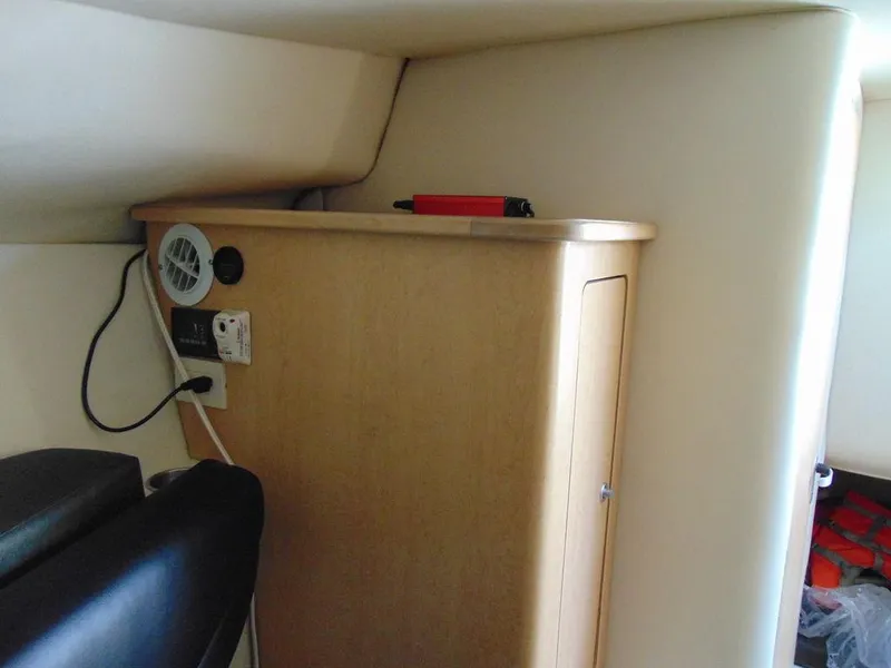 Slide: The Image of 2011 Hydra-Sports 3000VX Express cabin interior with storage and electrical panel. - 29