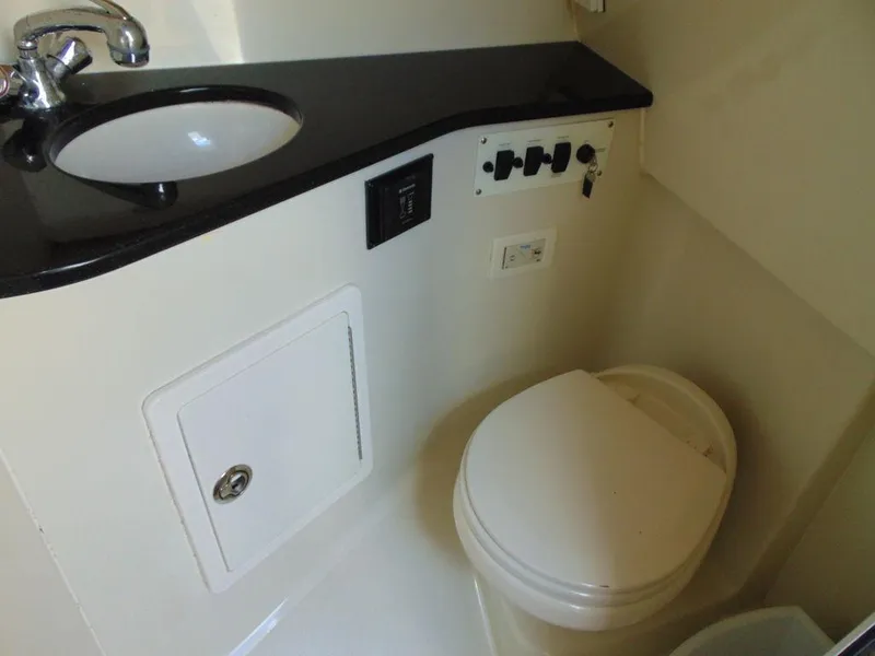 Slide: The Image of 2011 Hydra-Sports 3000VX Express boat bathroom with sink and toilet. - 31