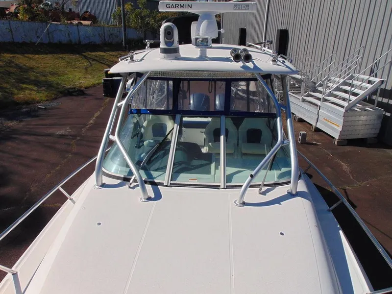 Slide: The Image of 2011 Hydra-Sports 3000VX Express boat with Garmin equipment, docked near a warehouse. - 39