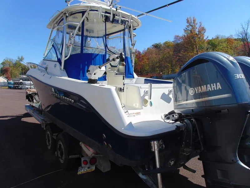 Slide: The Image of 2011 Hydra-Sports 3000VX Express boat with Yamaha engine, parked outdoors. - 6