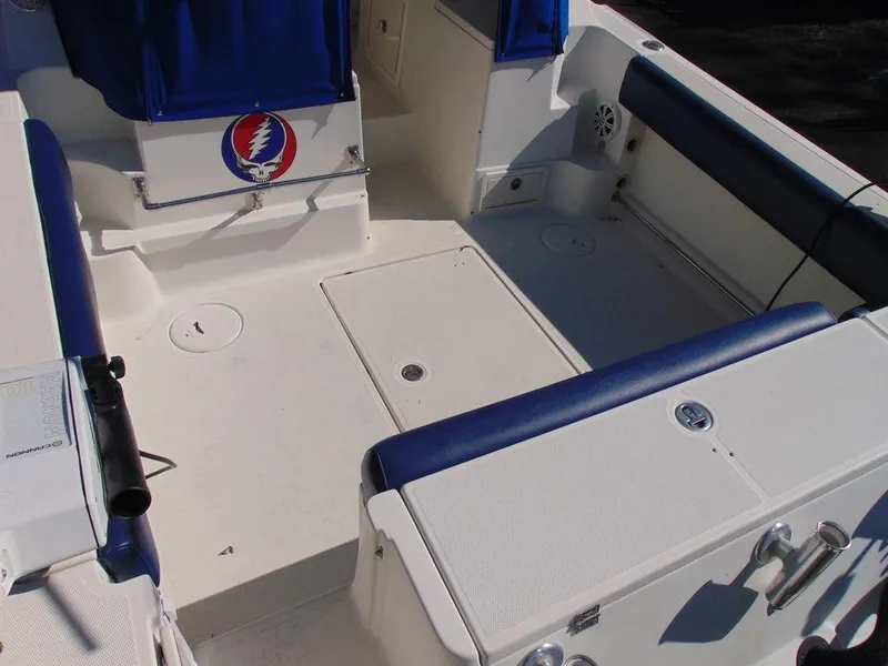 Slide: The Image of 2011 Hydra-Sports 3000VX Express boat interior with blue seating and storage compartments. - 7