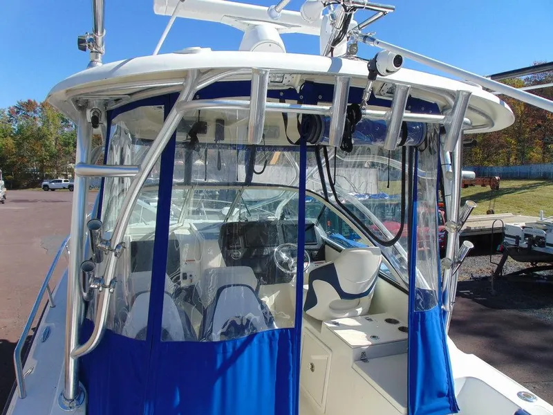 Slide: The Image of 2011 Hydra-Sports 3000VX Express boat with blue canopy and modern cockpit design. - 8