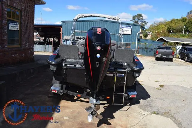 Slide: The Image of 2024 Triton 206 Allure boat at Thayer's Marine dealership. - 10