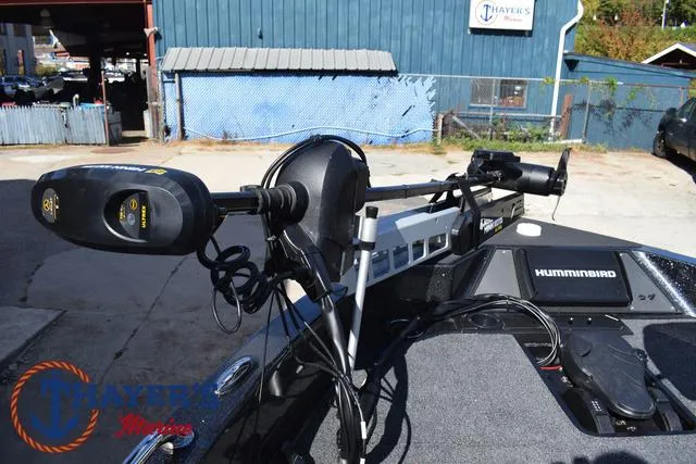 Slide: The Image of 2024 Triton 206 Allure boat with Humminbird electronics and motor, docked at Thayer's Marine. - 12