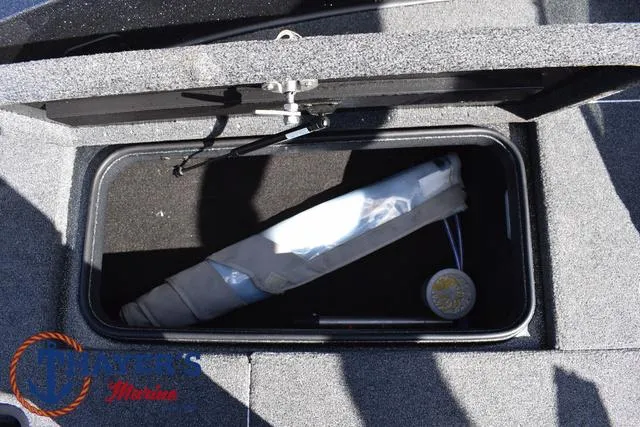 Slide: The Image of 2024 Triton 206 Allure storage compartment with fishing rod holder. - 17