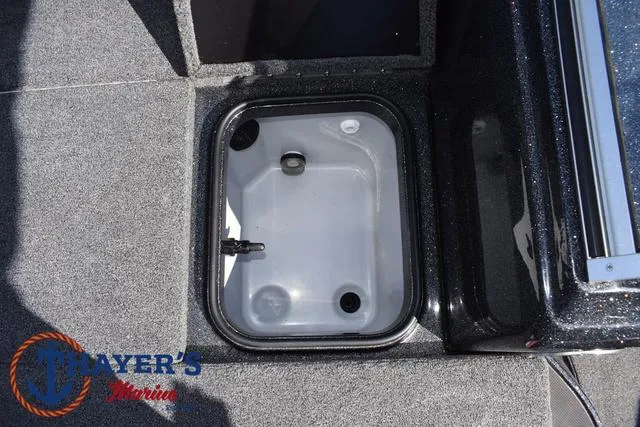 Slide: The Image of 2024 Triton 206 Allure boat storage compartment with Mayer's Marine logo. - 18