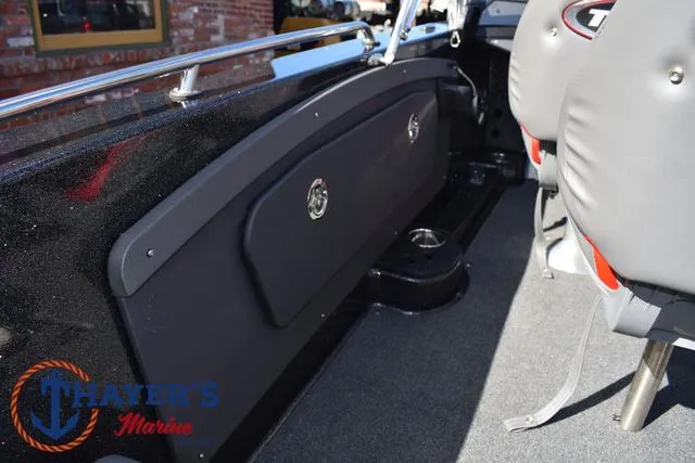 Slide: The Image of 2024 Triton 206 Allure boat interior with seating and storage compartments. - 26