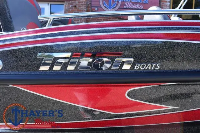 Slide: The Image of 2024 Triton 206 Allure boat with sleek red and black design. - 3