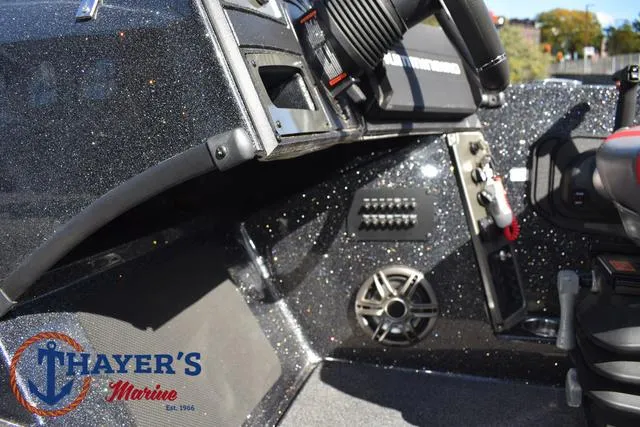 Slide: The Image of 2024 Triton 206 Allure boat dashboard with Thayer's Marine logo. - 31