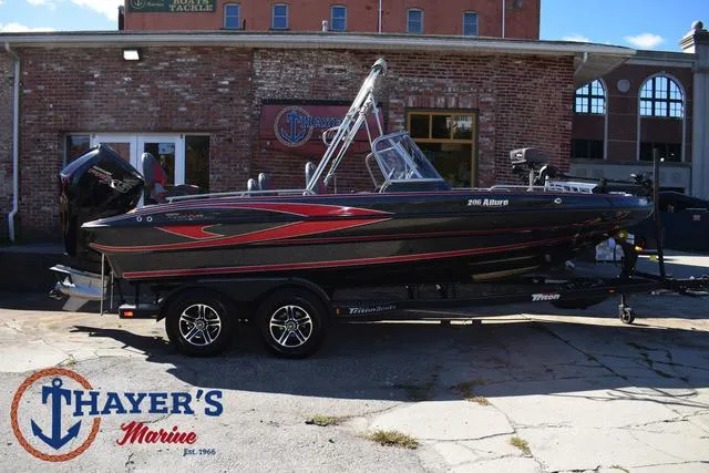 Slide: The Image of 2024 Triton 206 Allure boat at Thayer's Marine dealership. - 48