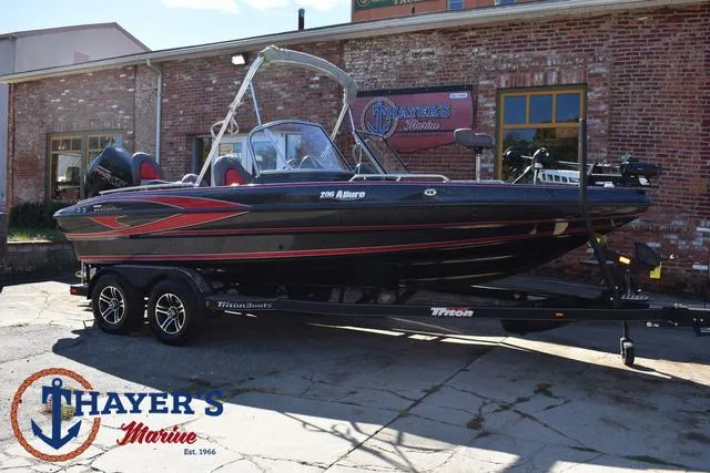 Slide: The Image of 2024 Triton 206 Allure boat at Thayer's Marine dealership. - 49