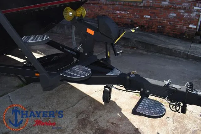 Slide: The Image of Trailer hitch of 2024 Triton 206 Allure boat at Thayer's Marine. - 7