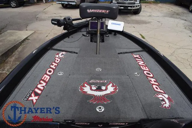 Slide: The Image of 2017 Phoenix Bass Boats 920 ProXP deck with branding and fishing equipment. - 14