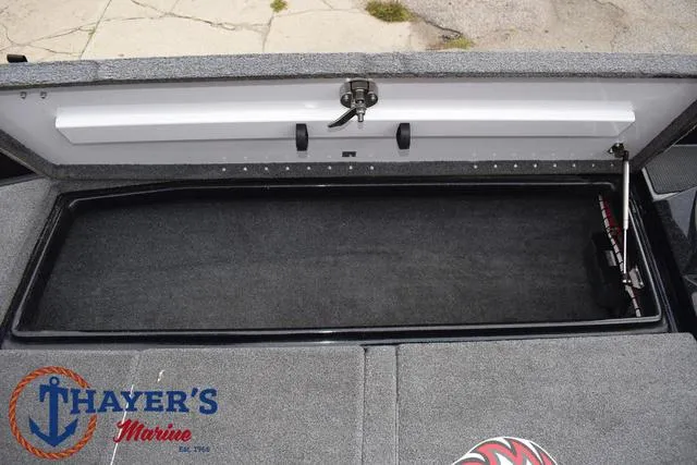 Slide: The Image of 2017 Phoenix Bass Boats 920 ProXP storage compartment, Thayer's Marine logo visible. - 16