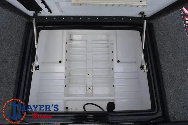 Slide: The Image of 2017 Phoenix Bass Boats 920 ProXP storage compartment with hydraulic lifts, open view. - 19