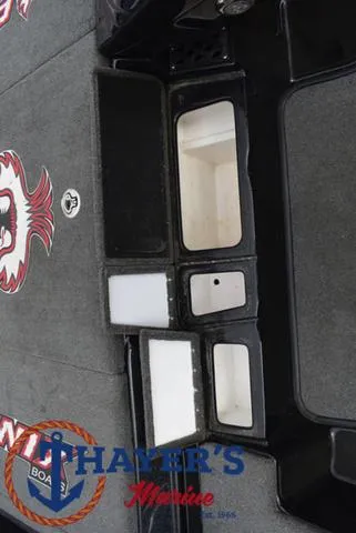 Slide: The Image of 2017 Phoenix Bass Boats 920 ProXP interior storage compartments, featuring Thayer's Marine logo. - 22