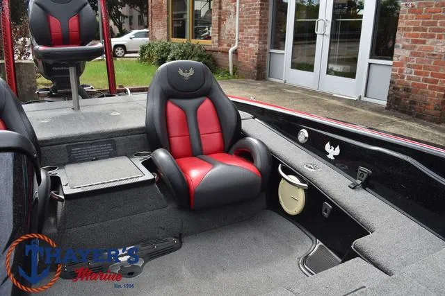 Slide: The Image of 2017 Phoenix Bass Boats 920 ProXP interior with red and black seating, showcased at Thayer's Marine. - 24