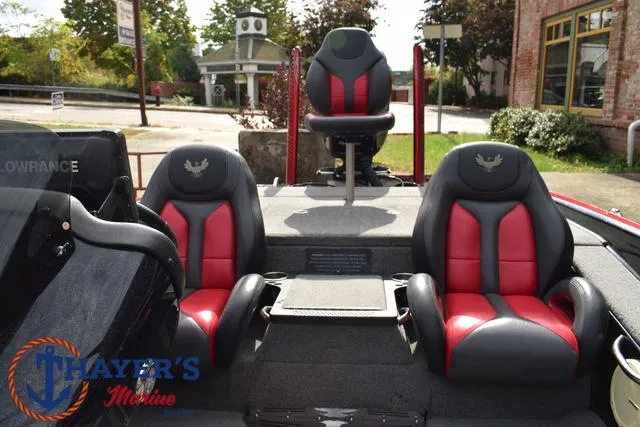 Slide: The Image of 2017 Phoenix Bass Boats 920 ProXP interior with red and black seats. - 25