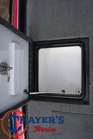 Slide: The Image of Open storage compartment on 2017 Phoenix Bass Boats 920 ProXP. - 35