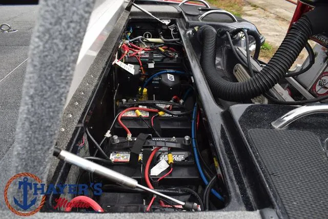 Slide: The Image of 2017 Phoenix Bass Boats 920 ProXP battery compartment with wiring and components. - 37