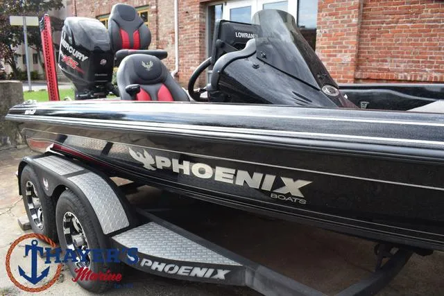 Slide: The Image of 2017 Phoenix Bass Boats 920 ProXP, black exterior, dual seats, trailer, parked outdoors. - 38