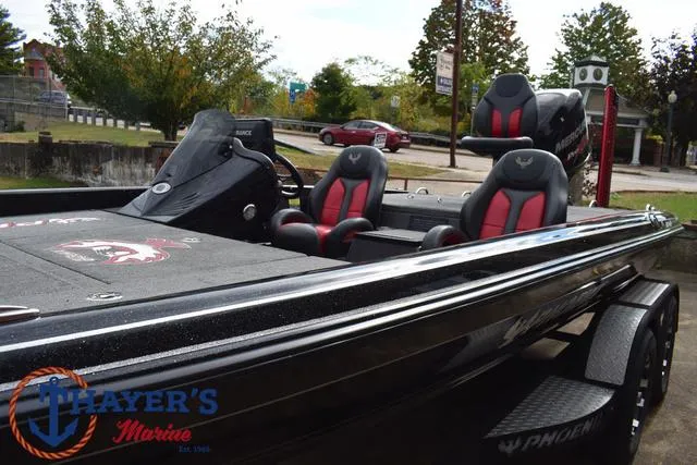 Slide: The Image of 2017 Phoenix Bass Boats 920 ProXP with dual seats, black and red design, at Thayer's Marine. - 39