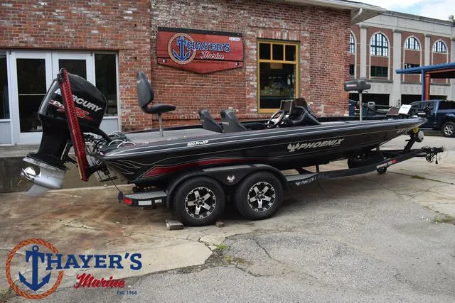 Slide: The Image of 2017 Phoenix Bass Boats 920 ProXP at Thayer's Marine, parked outdoors. - 42